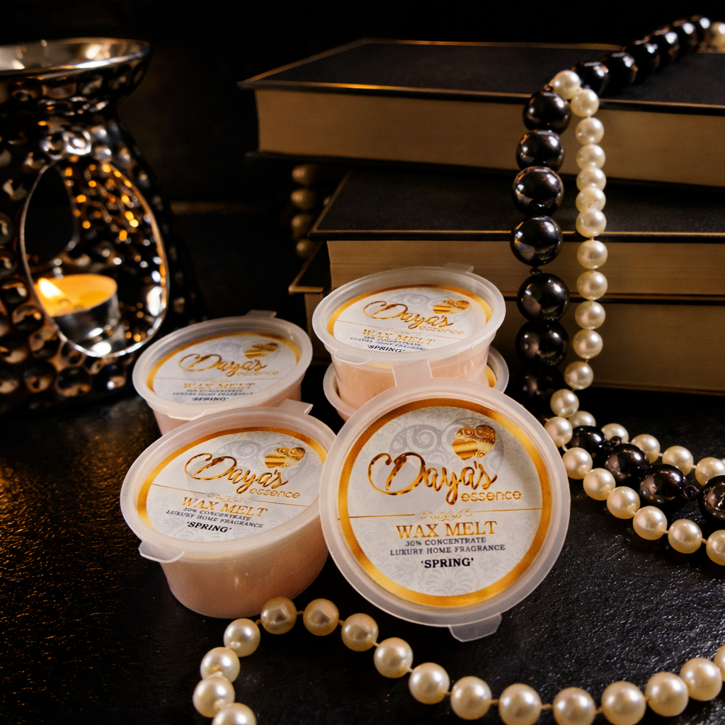 Luxury wax melts with a 30% fragrance load styled on a black and gold background, showing extra strong home fragrance melts in clear tubs