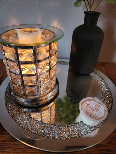 Daya's Essence warmer with Bora Bora melt, diamond pattern glow, linking scent to memory.
