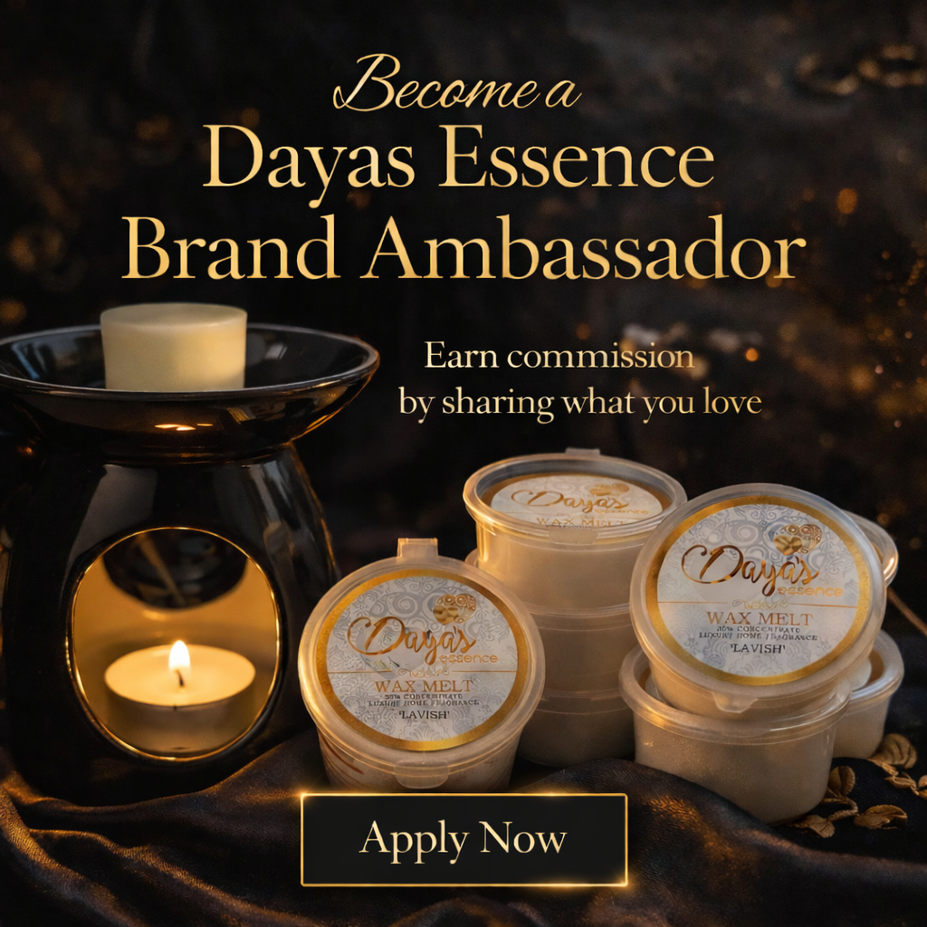 Luxury Dayas Essence wax melts in branded pots beside a lit ceramic wax burner, styled in a black and gold aesthetic for the brand ambassador programme
