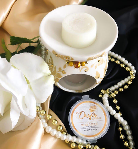 White-gold warmer with "Rosey Land" wax melt, pearls around, guide on removing wax easily.