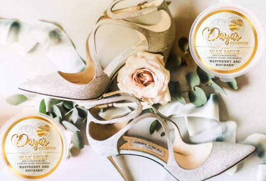 Sparkly heels beside Daya's Essence wax melts, illustrating scent diffusion in elevated areas.