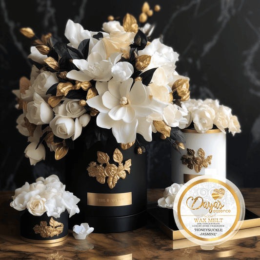 A 1oz tub with a branded sticker with the name "Honeysuckle Jasmine" Positioned elegantly at the bottom right, the tub captures attention against a captivating backdrop of three stunning vases. Two vases exude an air of sophistication with their black hue and exquisite gold detailing, while a third vase, in pristine white with gold accents, adds a touch of elegance. The flowers within the vases form a harmonious blend of black, gold, and white blooms, creating a visually striking and luxurious ambiance. 